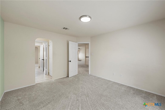125 Big Timber Dr, Temple, TX 76502 - unfurnished bedroom featuring arched walkways and light colored carpet