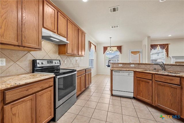 125 Big Timber Dr, Temple, TX 76502 - kitchen with white dishwasher, stainless steel electric range, under cabinet range hood, brown cabinetry, and recessed lighting