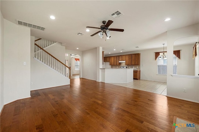 125 Big Timber Dr, Temple, TX 76502 - unfurnished living room with ceiling fan, light wood-style floors, recessed lighting, plenty of natural light, and stairs