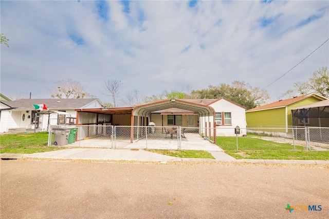 view of front of home featuring a detached carport, a gate, and fence