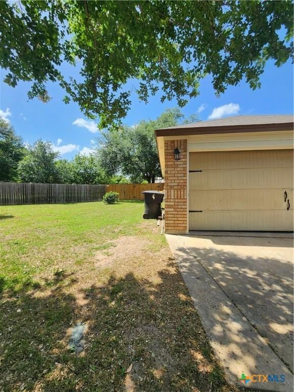 view of yard with a garage