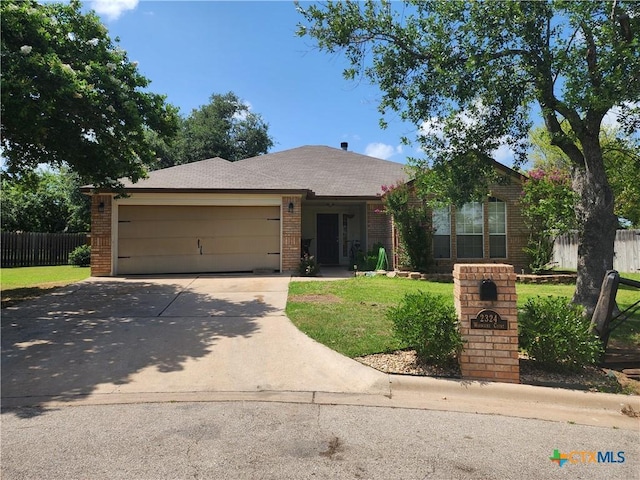 single story home featuring concrete driveway, a garage, and brick siding