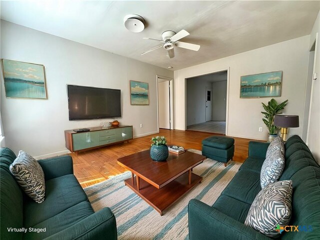 empty room featuring ceiling fan, a textured ceiling, light wood-type flooring, and french doors