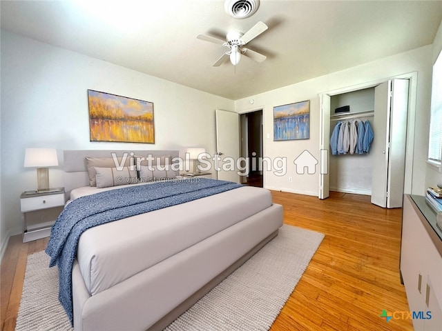 bedroom with a closet, visible vents, baseboards, and light wood-style floors