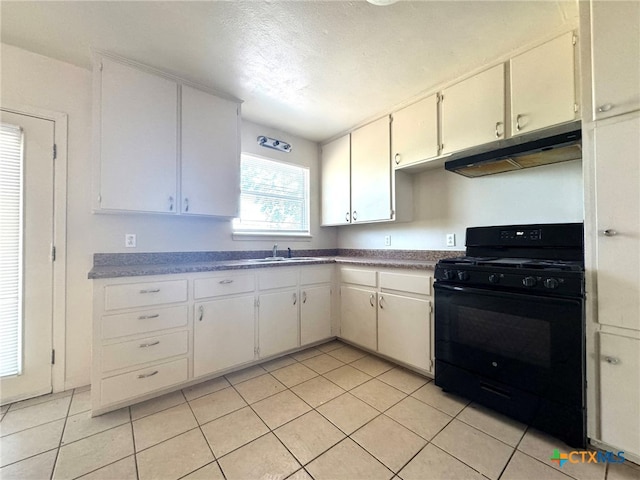 kitchen with sink, a textured ceiling, light tile patterned floors, white cabinets, and black range with gas cooktop