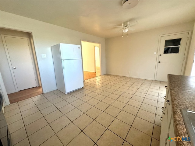 interior space featuring ceiling fan