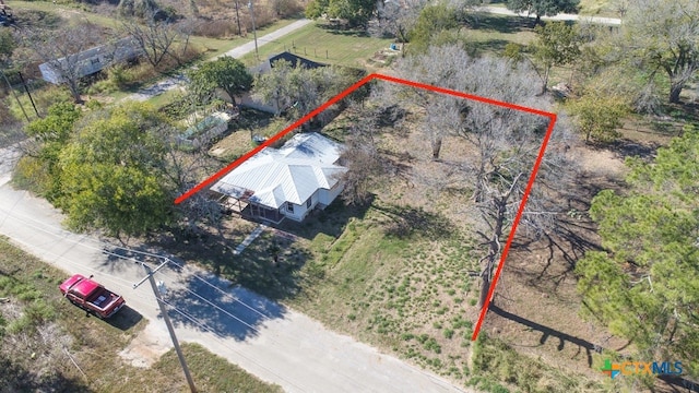 birds eye view of property with a rural view