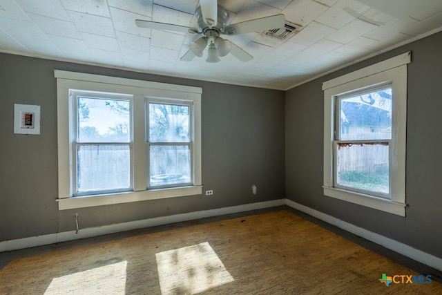 spare room with ceiling fan and dark hardwood / wood-style flooring