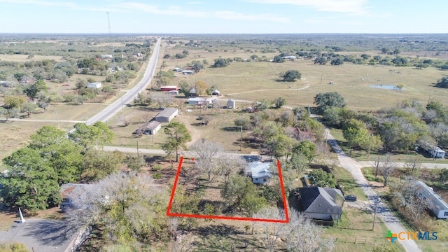 birds eye view of property with a rural view