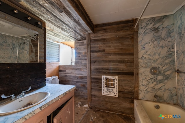 bathroom with vanity, wooden walls, heating unit, and a tub