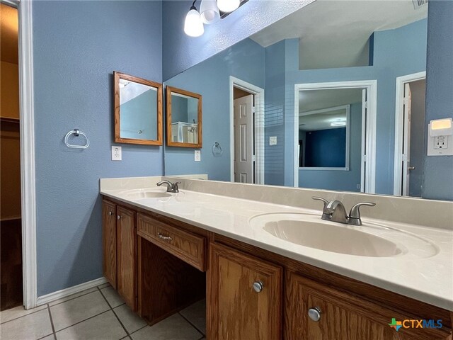 bathroom with vanity and tile patterned floors