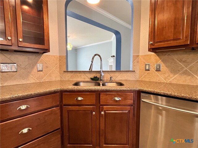 kitchen featuring decorative backsplash, crown molding, sink, and stainless steel dishwasher