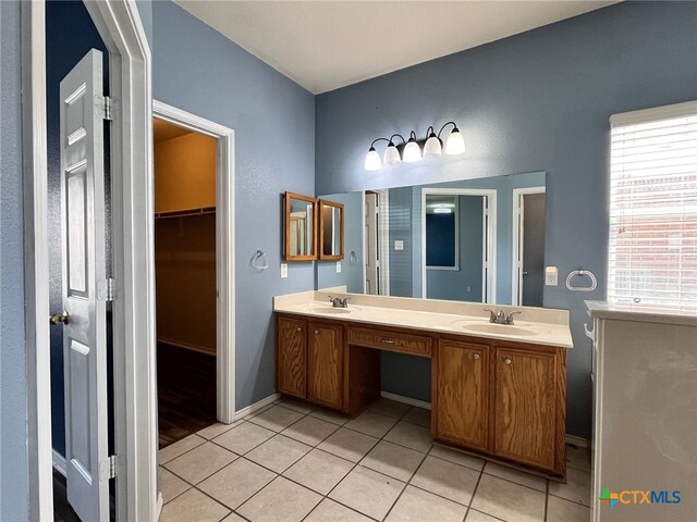 bathroom with tile patterned floors and vanity