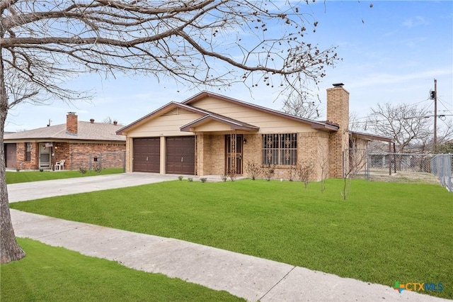 single story home with fence, a front lawn, driveway, a garage, and brick siding