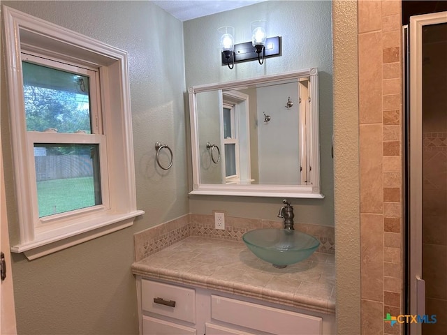 2303 Bon Aire Ave, Victoria, TX 77901 - bathroom with vanity and a textured wall