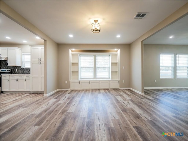 unfurnished living room featuring light hardwood / wood-style flooring