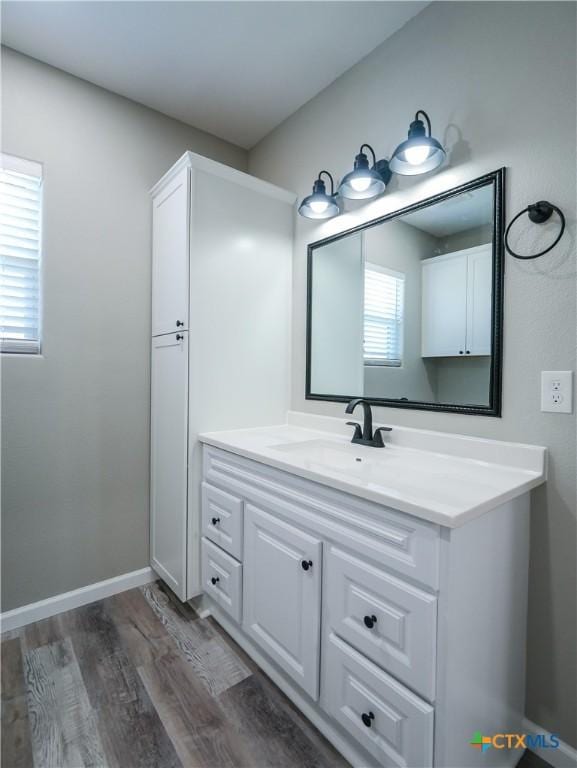 bathroom featuring vanity and hardwood / wood-style flooring