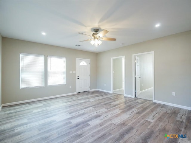 entryway with ceiling fan and light hardwood / wood-style flooring