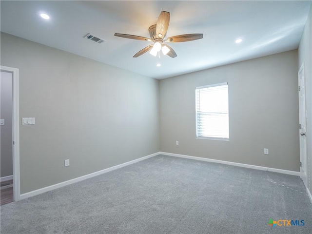 unfurnished room with ceiling fan and carpet floors