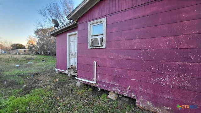 view of side of home with cooling unit