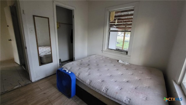 bedroom featuring a closet and wood finished floors