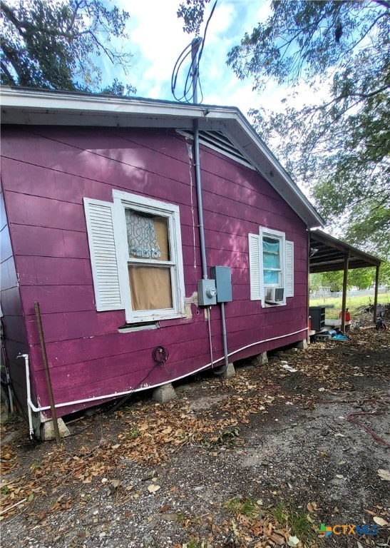 view of side of property with cooling unit