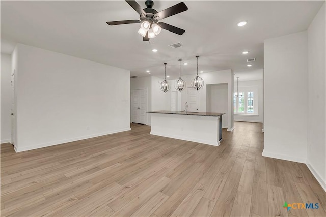 unfurnished living room with a ceiling fan, light wood-style flooring, visible vents, and recessed lighting