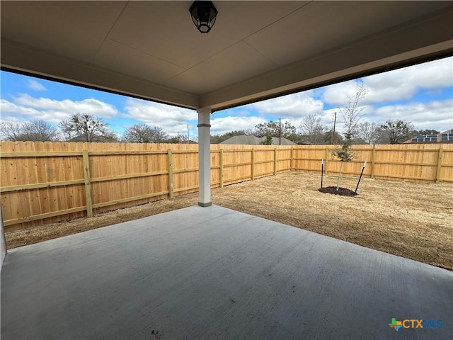 view of yard featuring a patio area and a fenced backyard