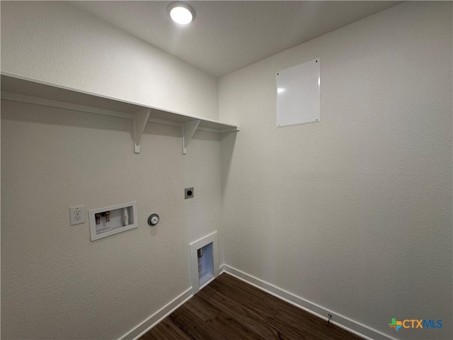 laundry area featuring dark wood-style floors, baseboards, hookup for an electric dryer, gas dryer hookup, and laundry area