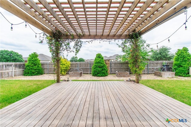 deck featuring a lawn, a fenced backyard, and a pergola