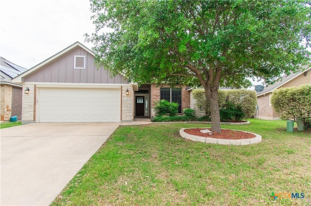 view of front of home featuring board and batten siding, an attached garage, concrete driveway, and a front lawn