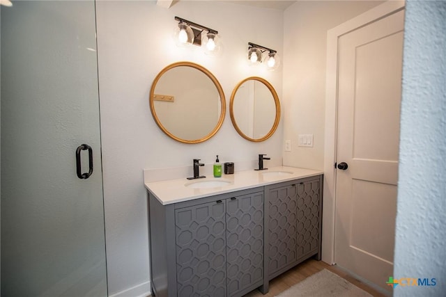1707 N Ocean Dr, Port Lavaca, TX 77979 - bathroom with double vanity and wood finished floors