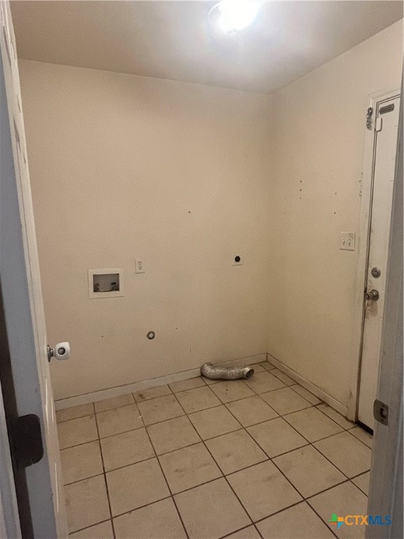 laundry area featuring hookup for a gas dryer, hookup for a washing machine, light tile patterned floors, and electric dryer hookup