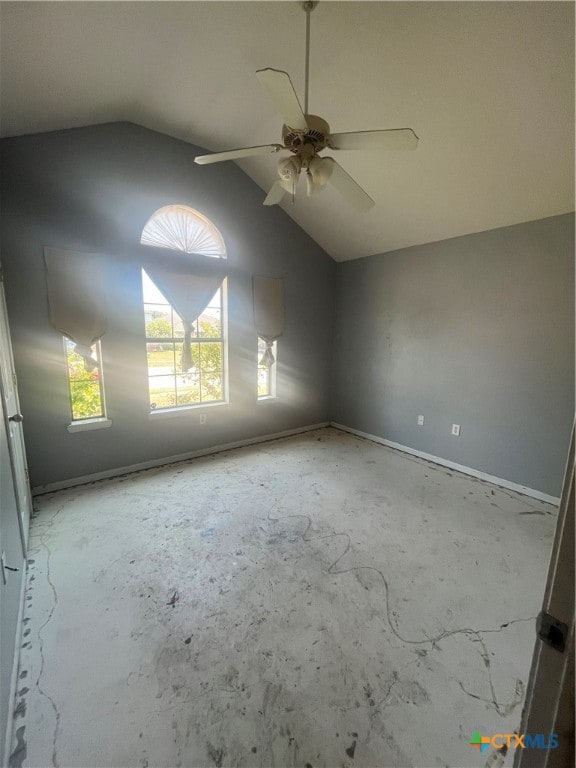 unfurnished room featuring vaulted ceiling and ceiling fan