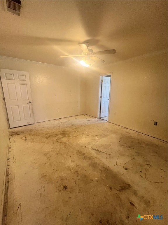 empty room featuring ornamental molding and ceiling fan