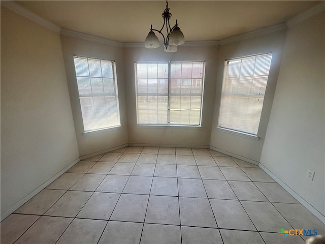 unfurnished dining area featuring ornamental molding, a wealth of natural light, a notable chandelier, and light tile patterned flooring