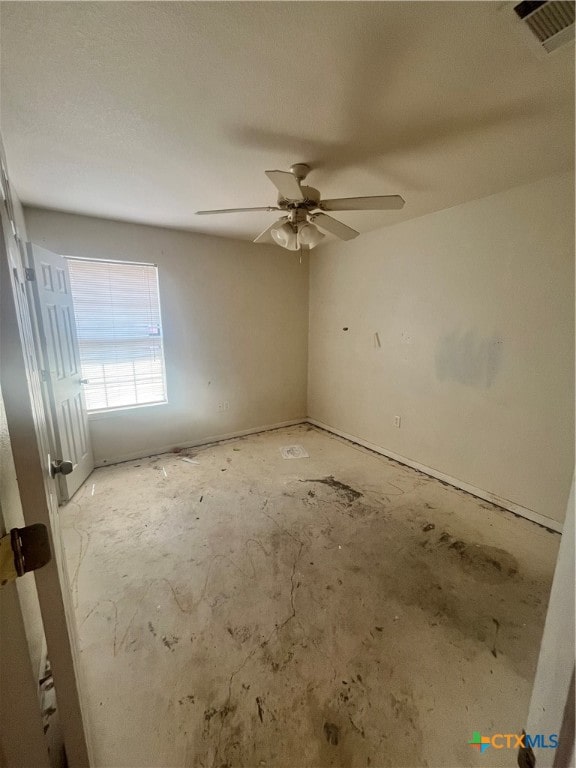 spare room with ceiling fan