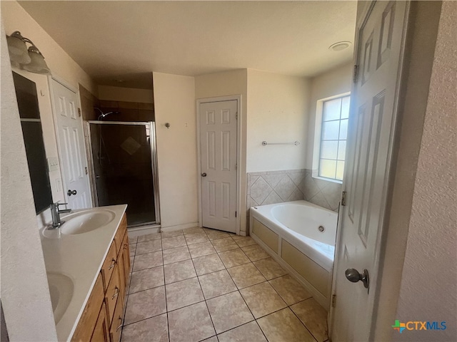 bathroom with vanity, independent shower and bath, and tile patterned flooring