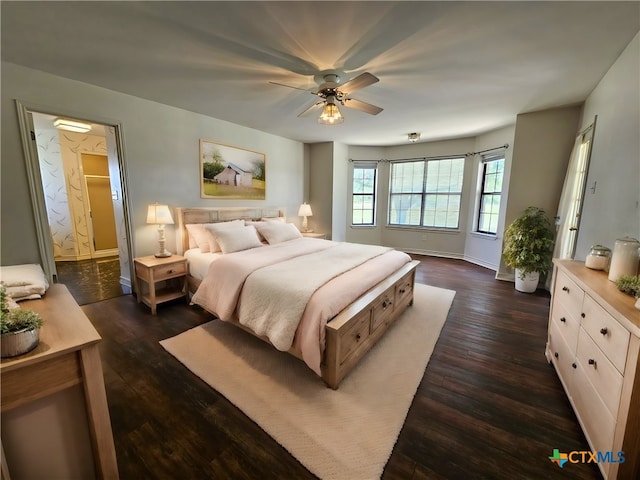 bedroom with ceiling fan and dark hardwood / wood-style floors