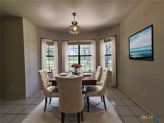 dining area with light tile patterned floors