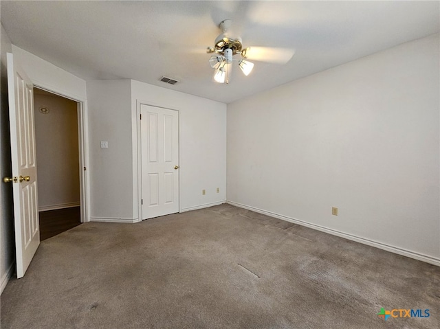 unfurnished bedroom featuring ceiling fan and carpet