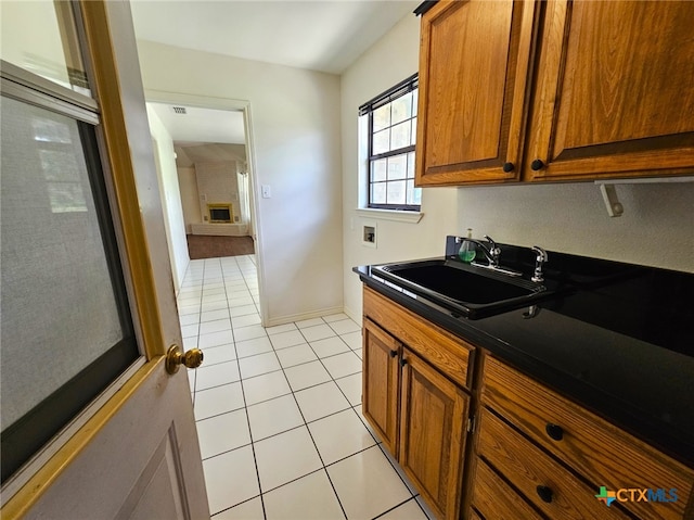 kitchen with sink and light tile patterned floors