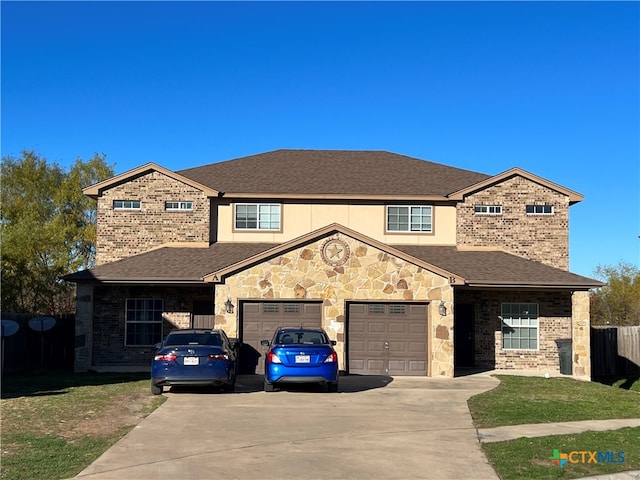 view of front facade with a front lawn and a garage