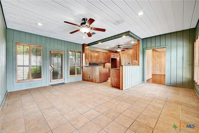 210 Oak Creek Cir, Luling, TX 78648 - kitchen featuring a ceiling fan, open floor plan, wood walls, refrigerator, and recessed lighting