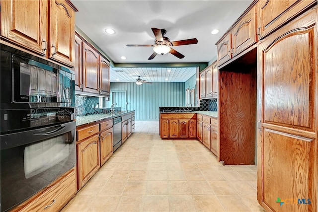 210 Oak Creek Cir, Luling, TX 78648 - kitchen with black appliances, ceiling fan, backsplash, recessed lighting, and brown cabinets