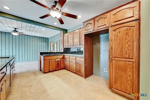 210 Oak Creek Cir, Luling, TX 78648 - kitchen featuring ceiling fan, a peninsula, brown cabinets, recessed lighting, and stovetop