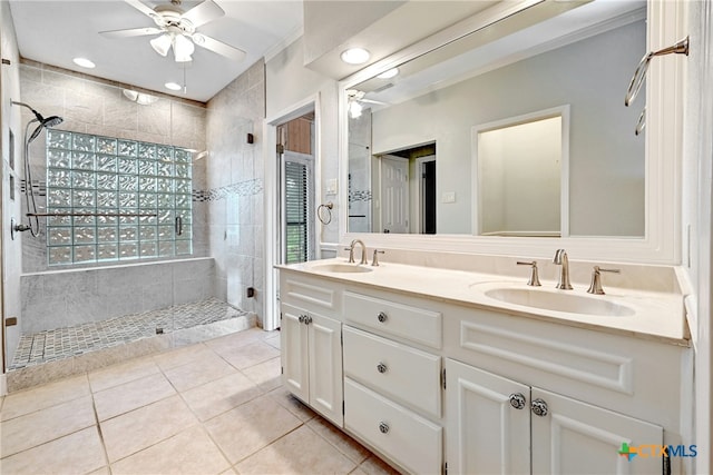 210 Oak Creek Cir, Luling, TX 78648 - bathroom featuring a ceiling fan, tile patterned flooring, walk in shower, double vanity, and recessed lighting
