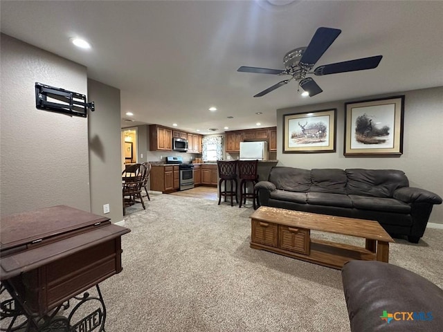 502 N Cherry St, Seguin, TX 78155 - living area featuring light colored carpet, ceiling fan, and recessed lighting