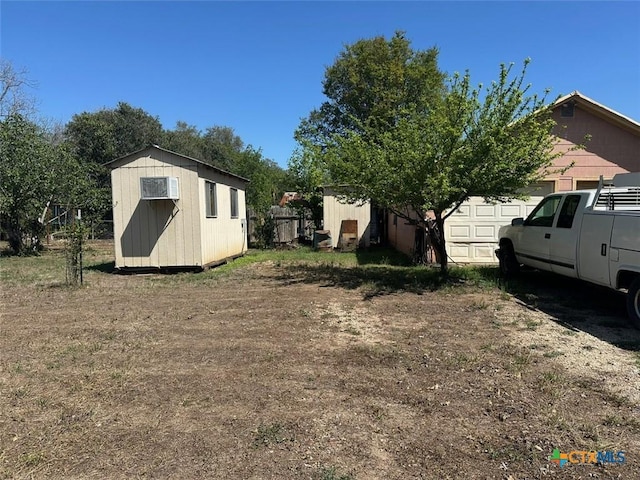 502 N Cherry St, Seguin, TX 78155 - view of yard featuring a shed, an outdoor structure, and an attached garage