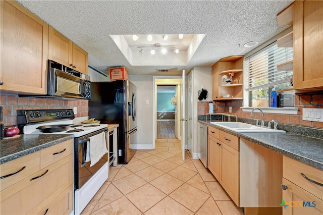 kitchen featuring a textured ceiling, tasteful backsplash, sink, and stainless steel appliances